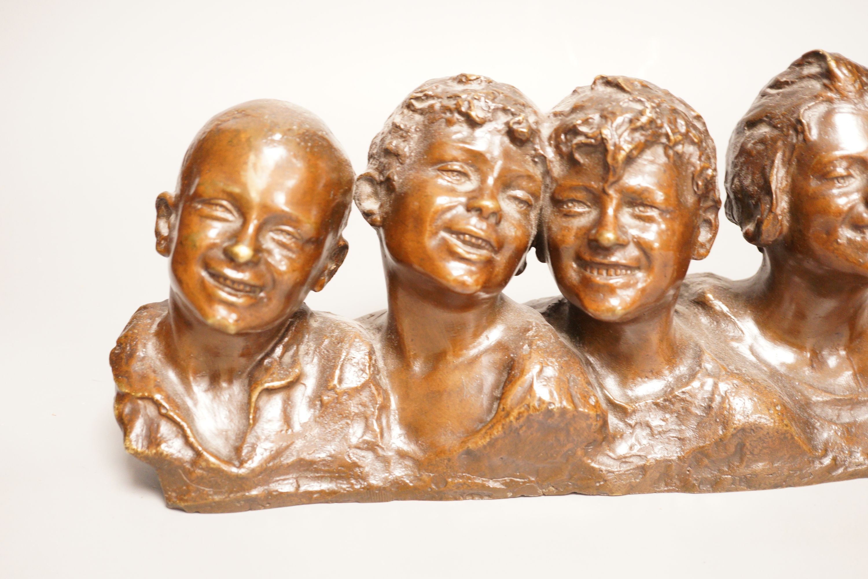 Vincenzo Aurisicchio, (Napoli 1855-1926) a bronze bust group of five smiling children, signed to reverse 40cm wide